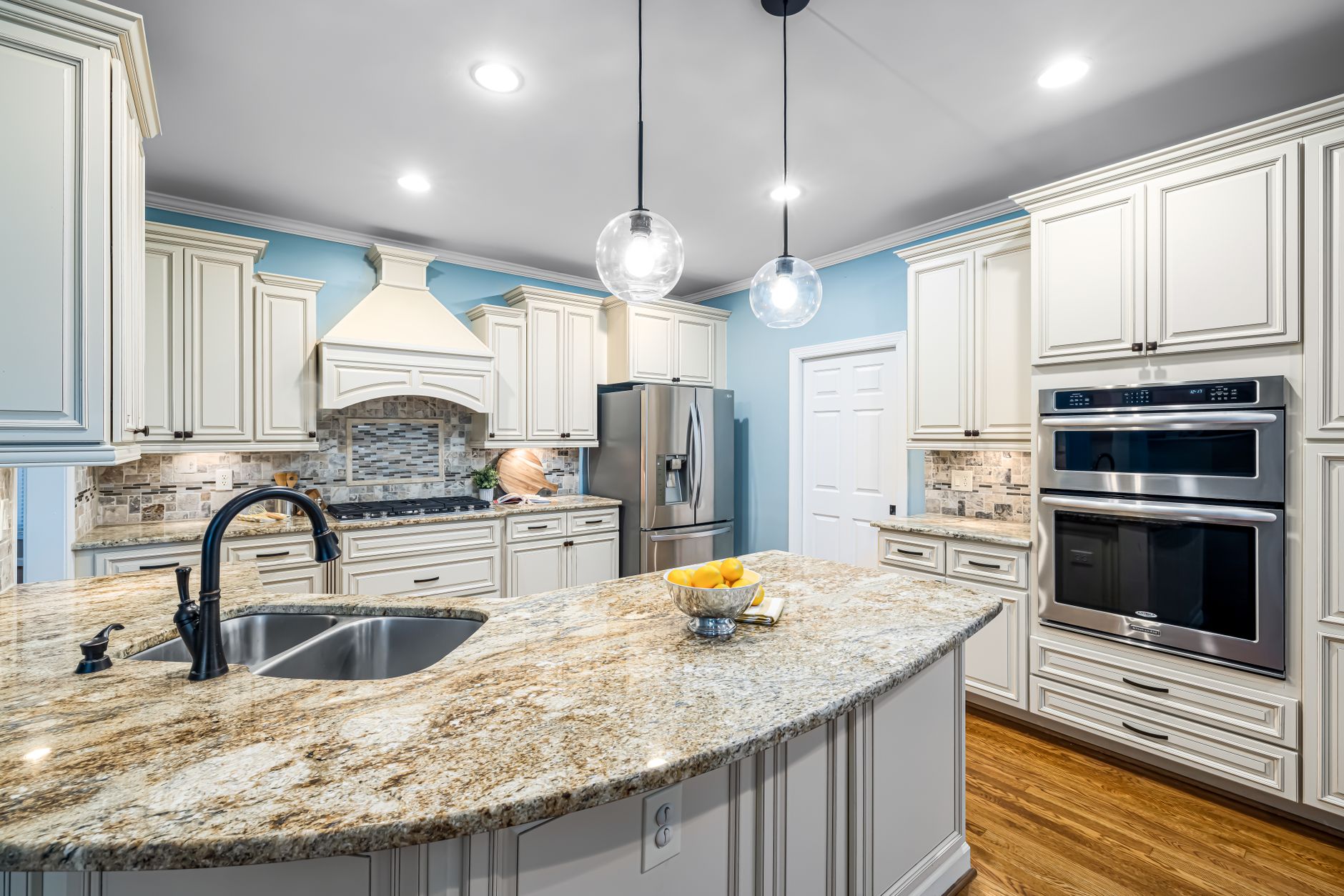 Stylish kitchen interior featuring marble countertops, stainless steel appliances, and custom cabinetry in Riverside, CA